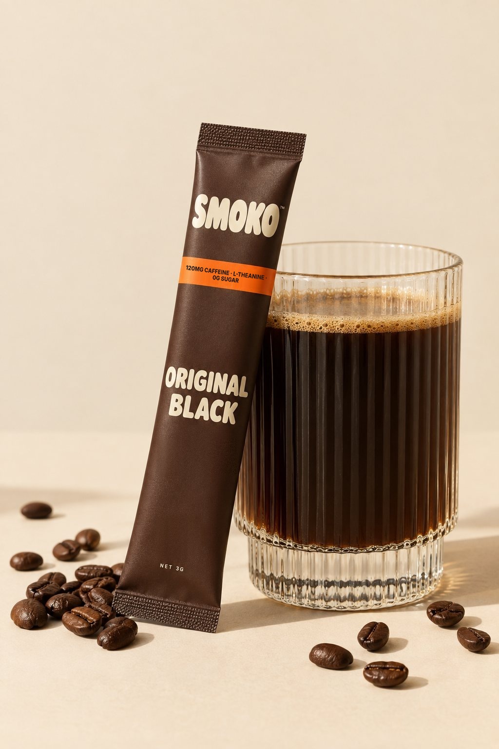 SMOKO Original Black coffee stick leaning on a glass of black coffee